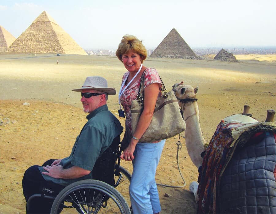 Tourists with wheelchair-accessible travel at the Giza Pyramids in Egypt