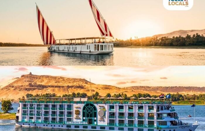 A Dahabiya and a Nile Cruise sailing on the Nile River with mountains in the background.